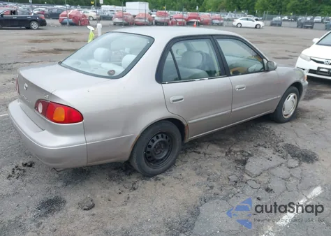 2001 Toyota Corolla Le z USA, uszkodzony, nr VIN 2T1BR12E41C430957